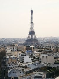 Tower in city against clear sky