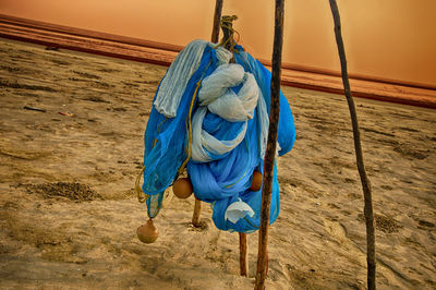 Close-up of rope tied up on beach