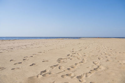 Scenic view of beach against clear sky