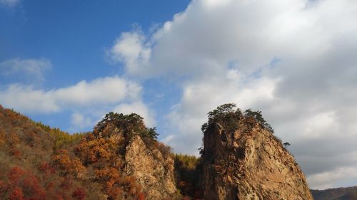 Low angle view of rock formation against sky