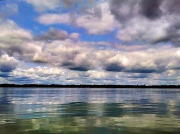 Scenic view of sea against cloudy sky