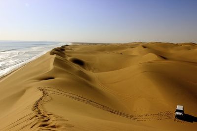 Scenic view of beach against clear sky