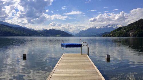 Pier over lake against sky