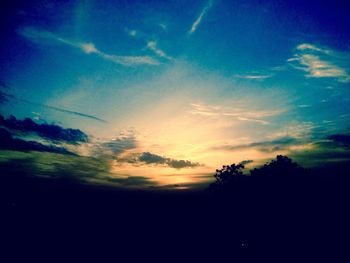 Silhouette landscape against sky during sunset