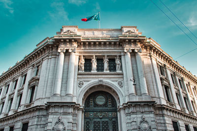 Main entrance of the bank of italy building with an enormous wrought iron, bronze gate