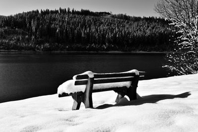 Scenic view of lake against sky during winter