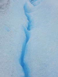 Close-up of heart shape on snow