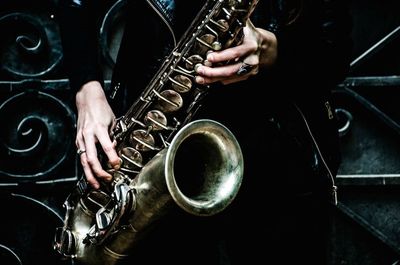 Midsection of person playing guitar