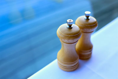 High angle view of salt and pepper shaker on table
