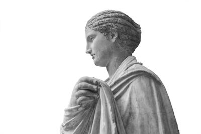 Portrait of statue against white background