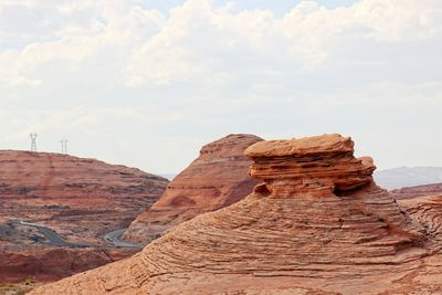 Rock formations on mountain against sky