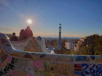 Panoramic view of city buildings against sky during sunset