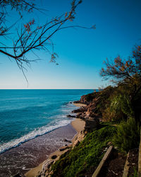 Scenic view of sea against clear blue sky