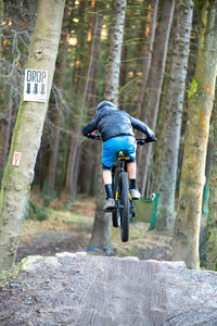 Full length of man riding bicycle