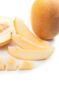 High angle view of orange fruit on white background