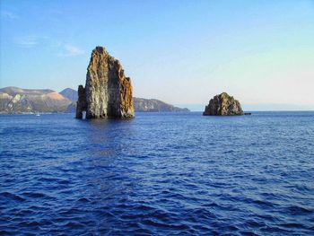 Scenic view of sea against clear blue sky