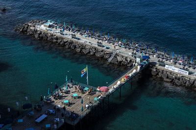 High angle view of boats moored at harbor