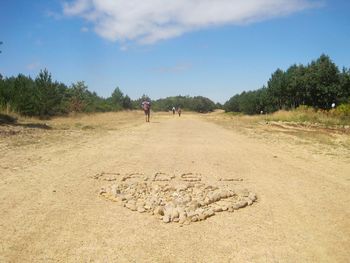 Woman walking on landscape