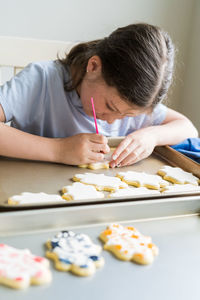 Side view of woman painting