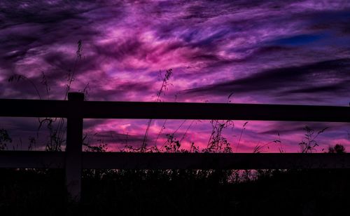 Low angle view of silhouette purple sky at dusk