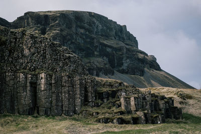 Old ruins on mountain against sky