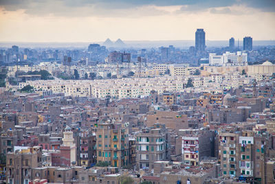 Cairo, egypt, cityscape with pyramids of giza on the horizon