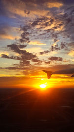 View of airplane at sunset