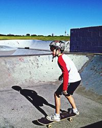 Full length of woman standing by railing