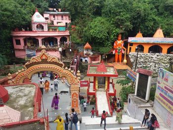 Group of people in temple outside building