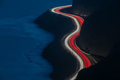 High angle view of light trails on road at night