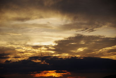 Low angle view of dramatic sky during sunset