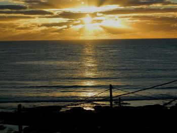 Scenic view of sea at sunset