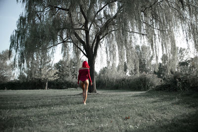 Side view of a man walking on country road