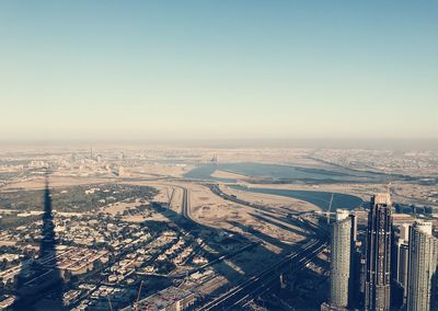 High angle view of buildings in city against clear sky