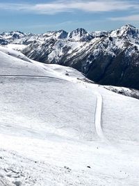 Snow covered mountains against sky