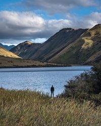 Scenic view of lake against cloudy sky