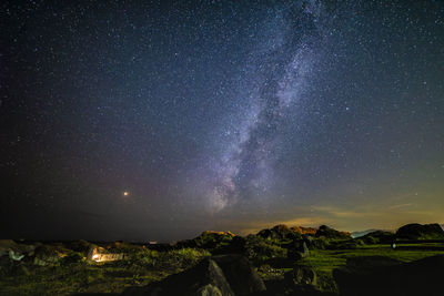 Scenic view of star field against sky at night