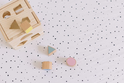 Pastel colored wooden toys in geometric forms