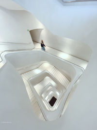 High angle view of woman on staircase