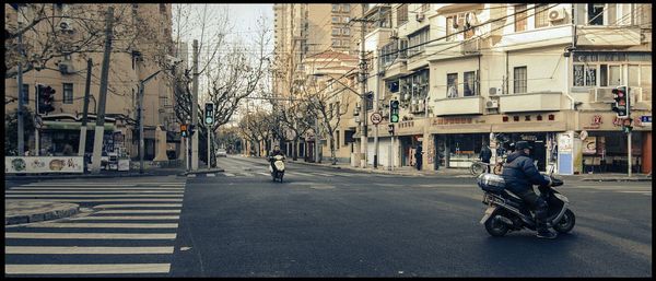 People walking on street in city