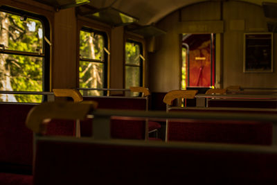 Close-up of chairs on table at home