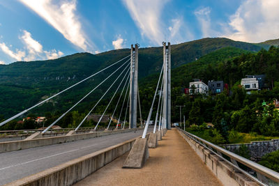 Bridge over road against sky
