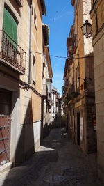 Narrow alley amidst buildings in town