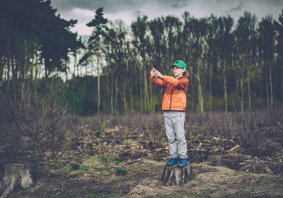 Full length of man standing in farm