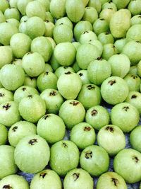 Full frame shot of wet guavas for sale at market