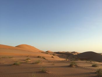 Scenic view of desert against clear sky