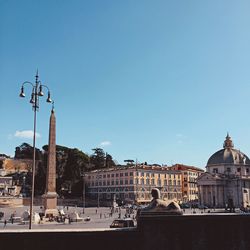 Piazza del popolo against blue sky on sunny day