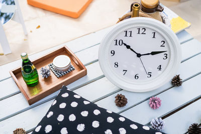 High angle view of clock on table