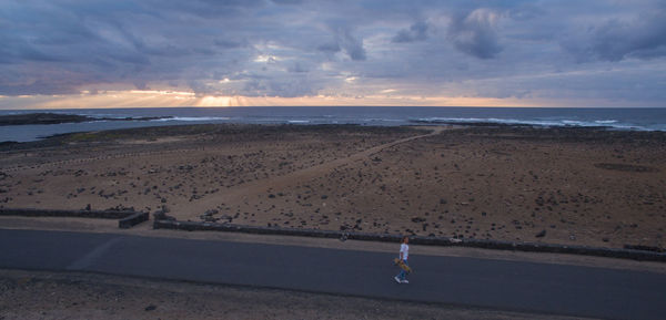 Scenic view of beach against sky during sunset