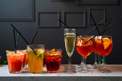 Set of cocktails and champagne in a glass on the bar table-top made for party guests